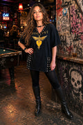 Woman wearing one-of-a-kind Bon Jovie grommet dress/tunic.