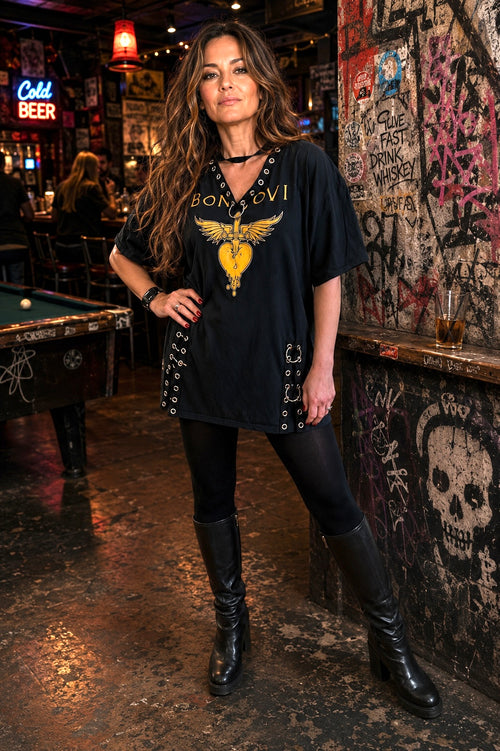 Woman wearing one-of-a-kind Bon Jovie grommet dress/tunic.
