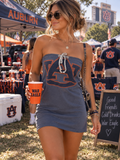 Woman wearing one-of-a-kind tube dress with Auburn logo.