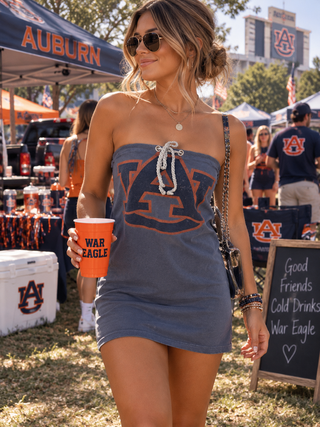 Woman wearing one-of-a-kind tube dress with Auburn logo.