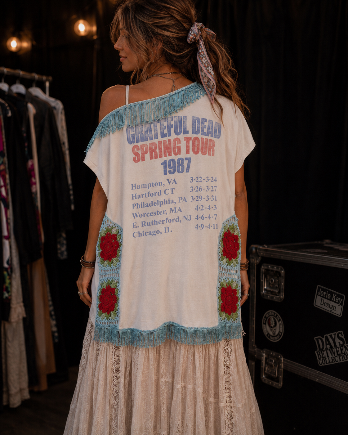 Back view of Grateful Dead Spring Tour 1987 tee with venue listings embellished with fringe and rose granny squares, paired with a long cream skirt. 