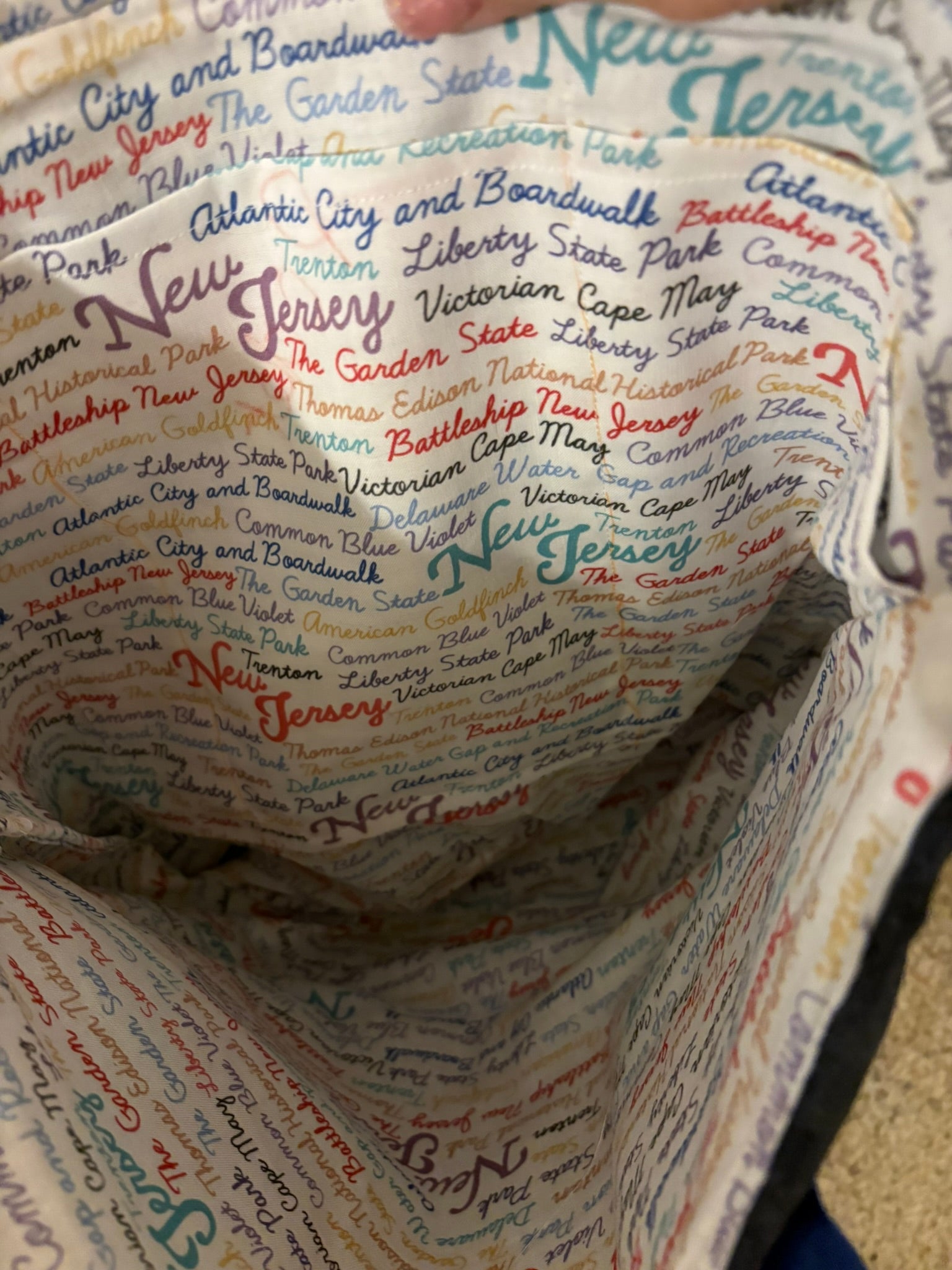 Interior has three pockets and an homage to everything New Jersey.