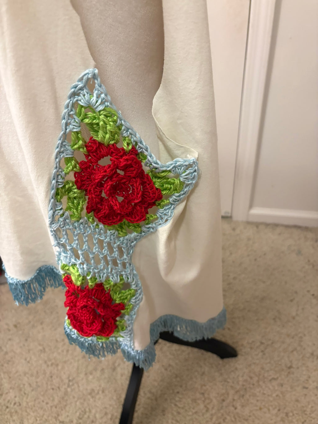 Rose granny squares down the sides make this a truly one of a kind piece of music history.