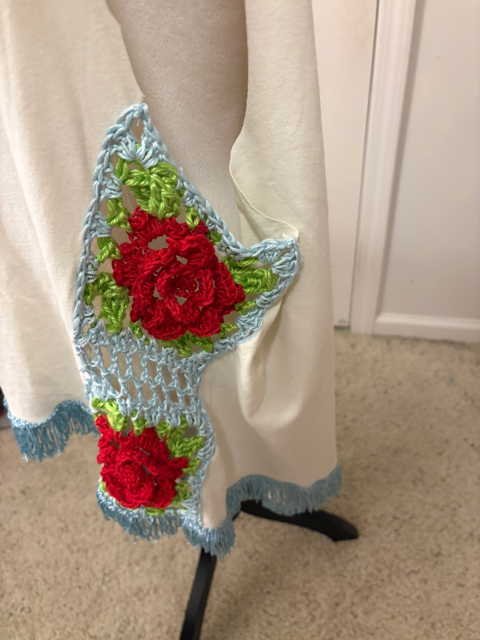 Rose granny squares down the sides make this a truly one of a kind piece of music history.