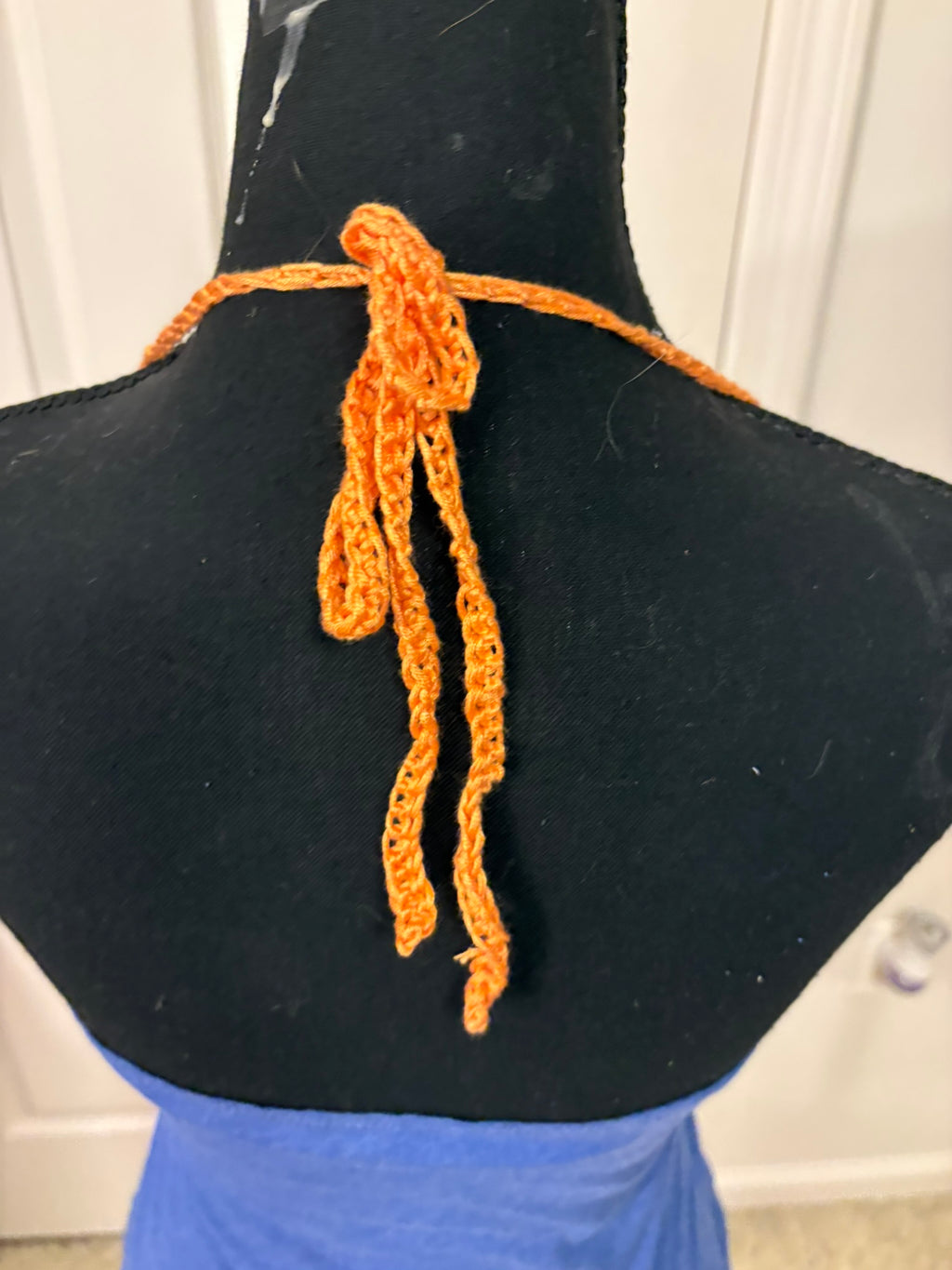 The back of the Florida Gators halter top with orange crocheted tie-neck.
