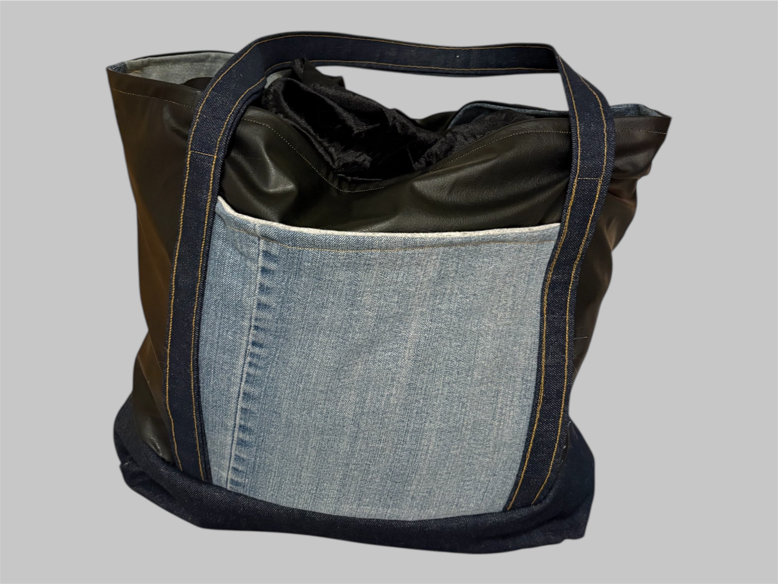 Harley Davidson large tote made with Vegan leather and denim including two interior authentic denim pockets.
