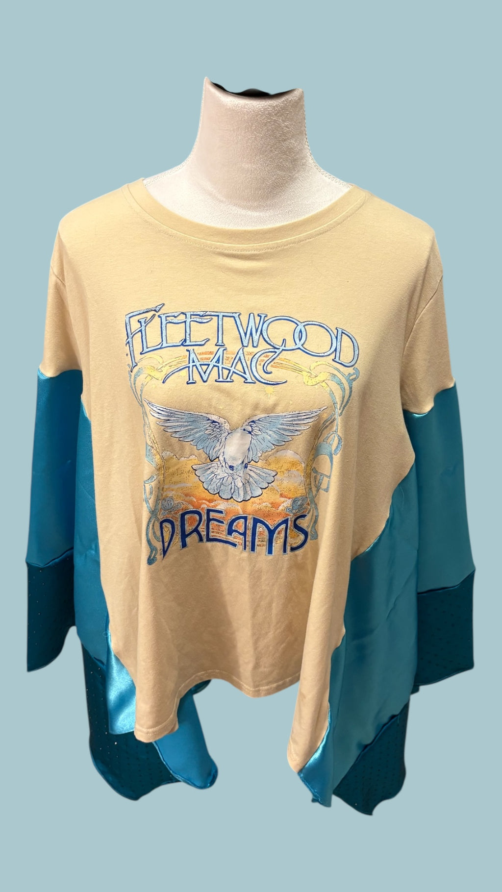 Fleetwood Mac graphic tee reimagined into a poncho with satin and rhinestones.