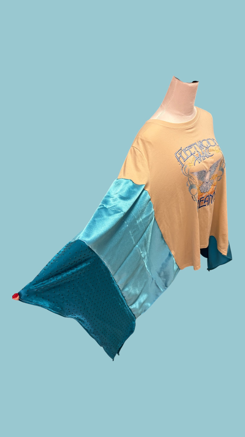 Fleetwood Mac graphic tee reimagined into a poncho with satin and rhinestones.