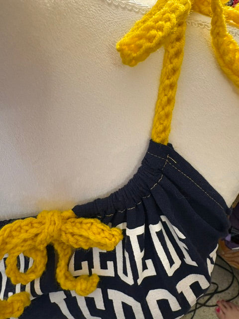 Gold Crochet details make this a truly unique statement piece.