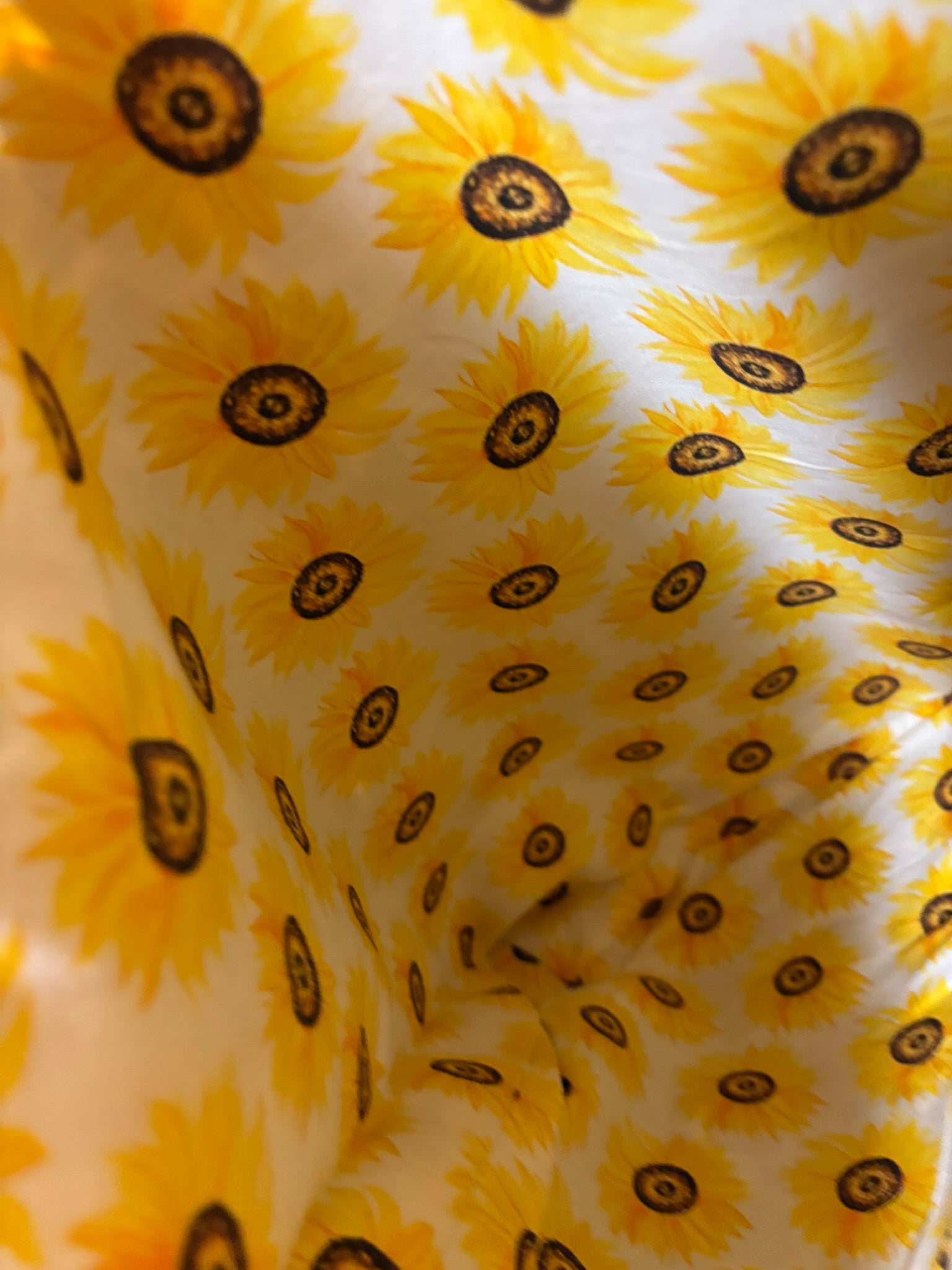 Fully lined interior with sunflower fabric.
