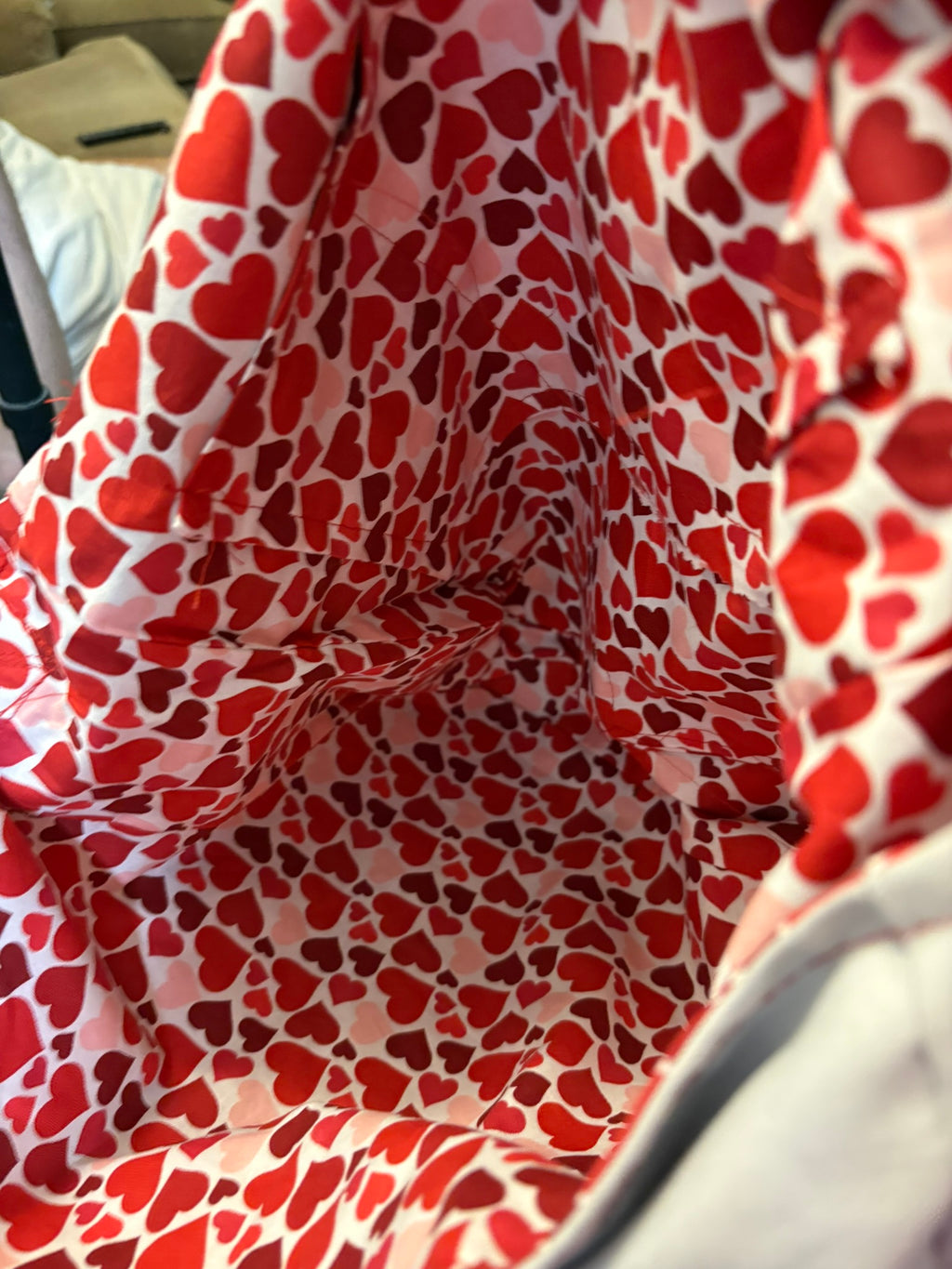 XOXO messenger bag is fully lined with love and has three interior pockets.